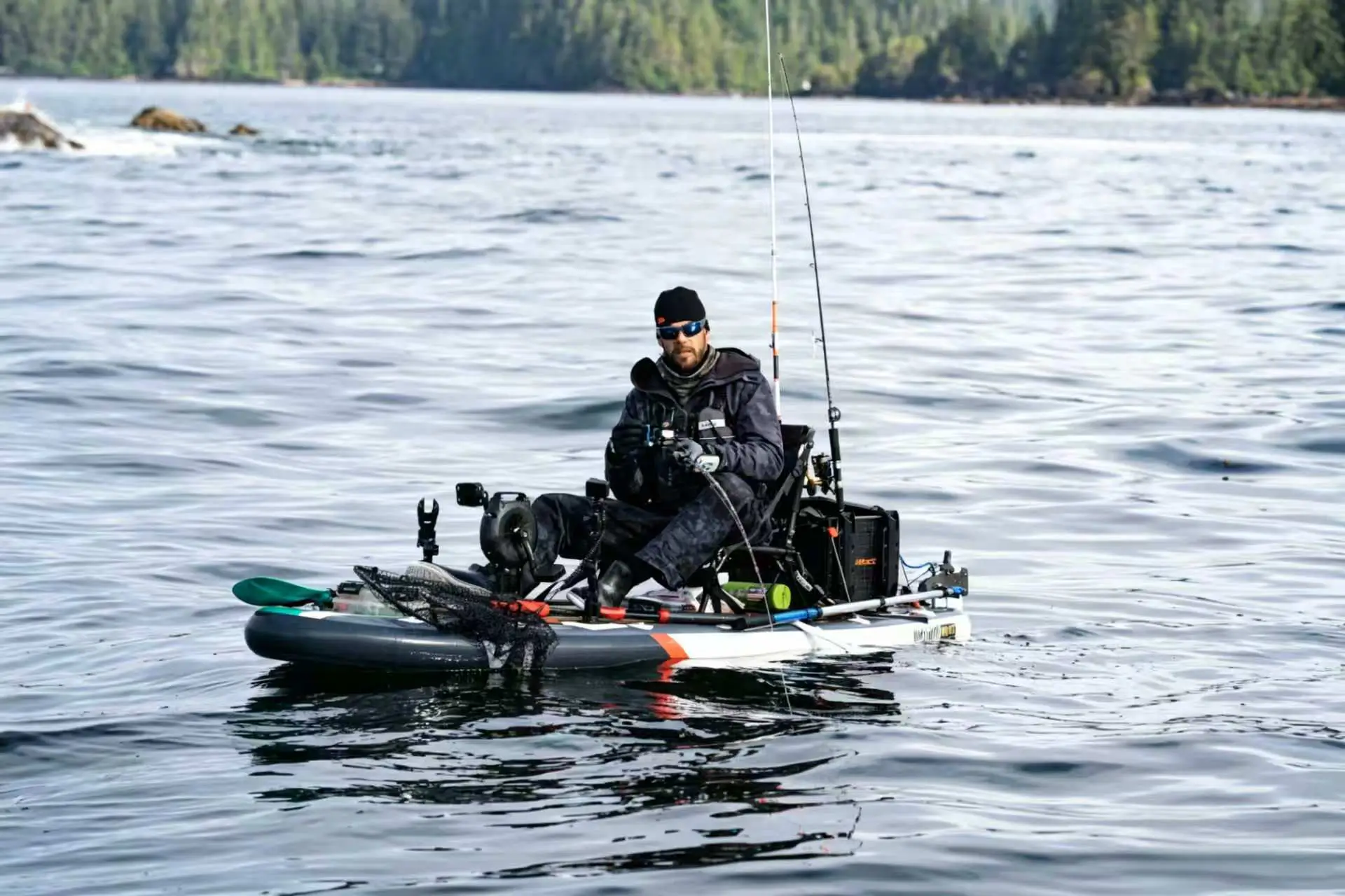 Inflatable fishing kayak with a more crowded and hardware-heavy setup, reducing usable deck space