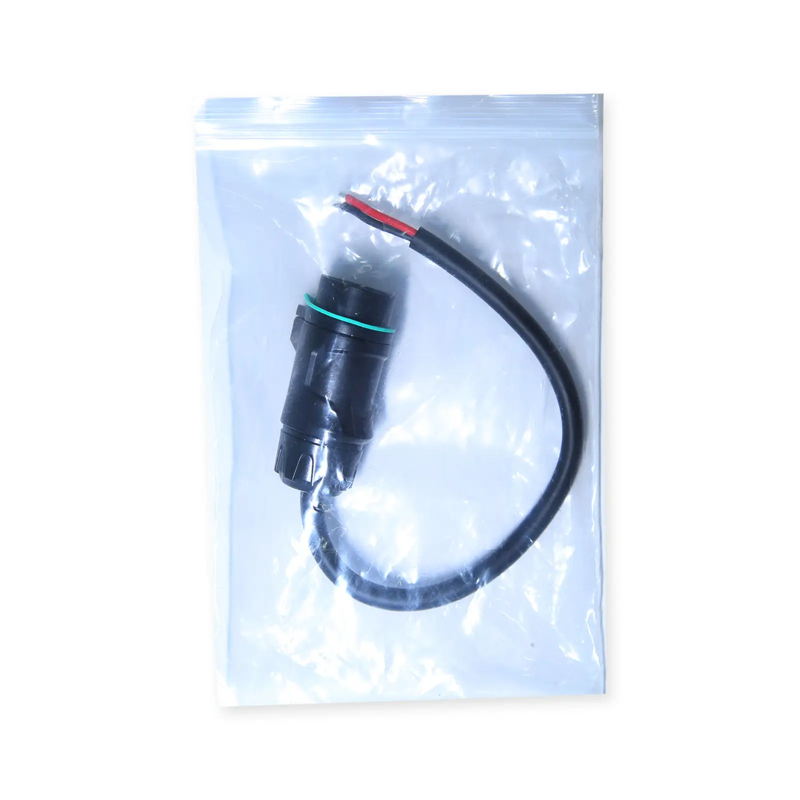 Package view of the TEDGIX K4 replacement waterproof plug and cable assembly, sealed in a protective bag.