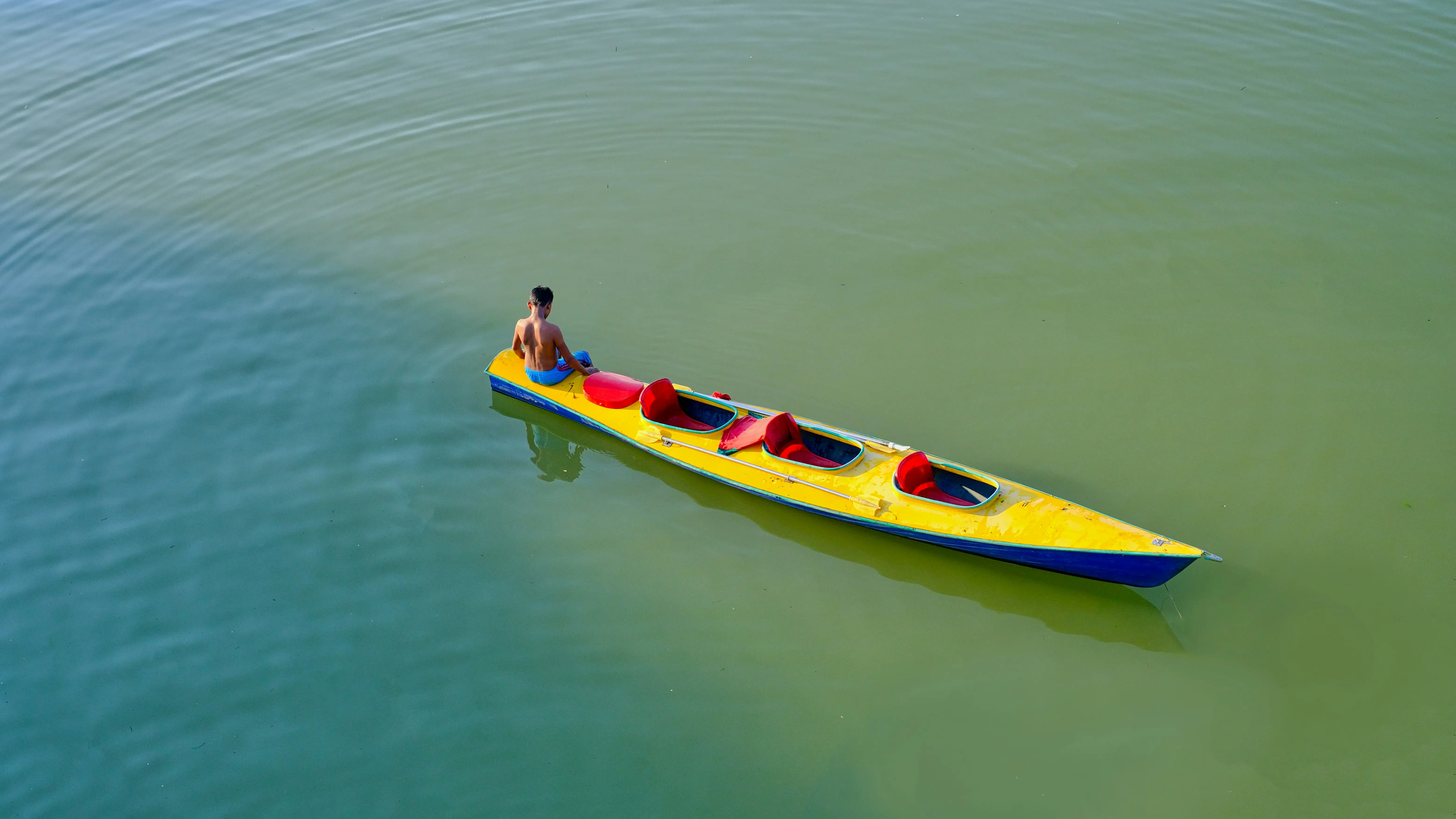 Overhead view of kayaks on calm water, representing balance, direction, and complete kayak systems